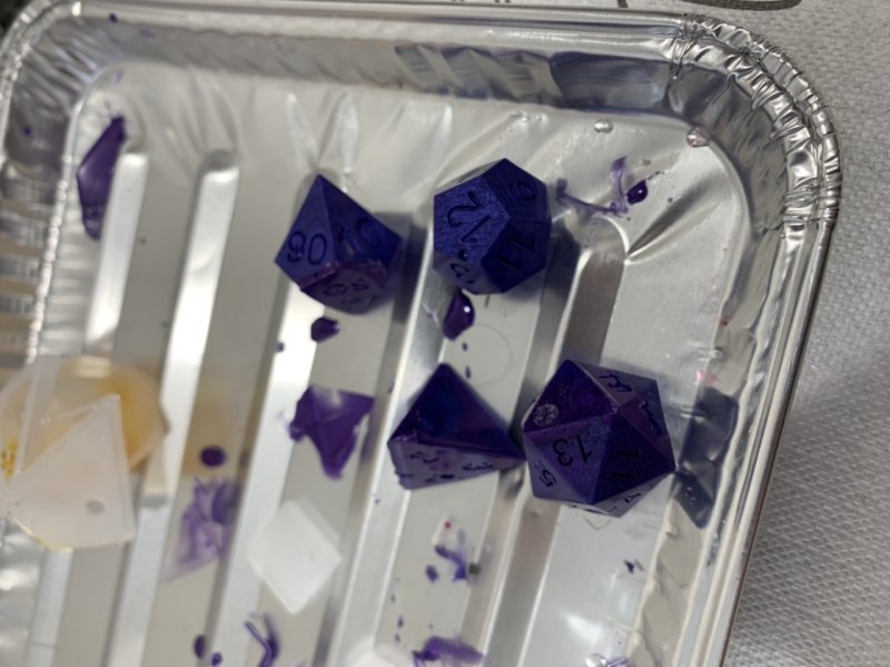 Resin-cast dice in purple. 