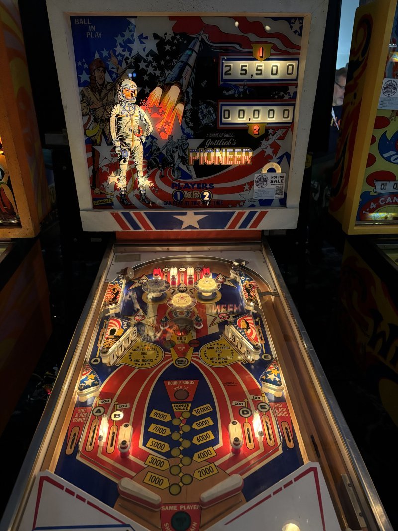 Pioneer — an older pinball table with wires and relays instead of a digital experience.